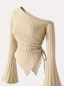 Elegant beige one-shoulder ribbed knit top with asymmetrical hem and flare sleeves