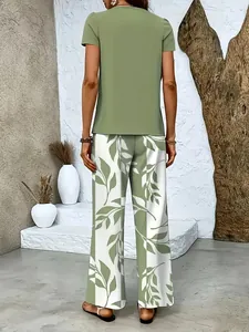 Back view of women's green short sleeve top and leaf print wide leg pants set
