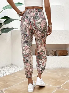 Back view of ethnic paisley print bohemian trousers with elastic cuffs and vibrant pattern