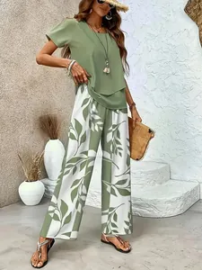 Detailed view of women's olive green top and leaf print wide-leg pants summer set