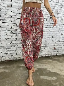 Detailed view of ethnic pattern print on bohemian harem trousers with elastic waist.
