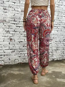 Detail view from the back of bohemian ethnic paisley pattern printed harem pants