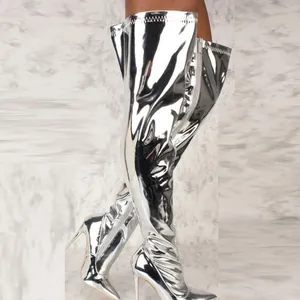 Detail shot of metallic silver thigh-high boots with stiletto heels and pointed toe