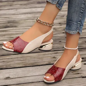 Detail of color-block peep-toe slingback sandals with burgundy croc-patterned toe strap