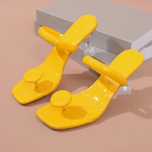 Yellow glossy thong high heel sandals with stylish transparent wine glass heel