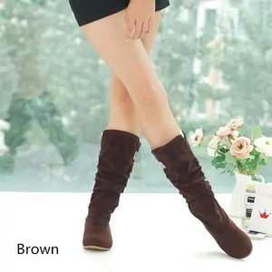 Close-up of stylish brown suede slouchy mid-calf boots for women's winter casual outfits