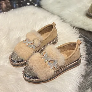 Luxury women's winter loafers featuring warm faux fur and sparkling rhinestone butterflies