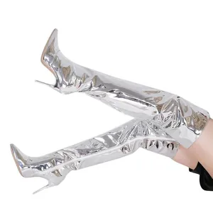 Metallic silver over-the-knee thigh-high boots featuring sharp stiletto heels and pointed toe