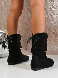 Stylish black suede mid-calf boots featuring a back lace-up design for women.