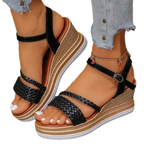 Stylish black wedge sandals with braided straps and platform espadrille sole for women.