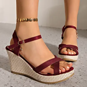 Elegant burgundy suede cross strap wedge sandals with thick platform and ankle buckle