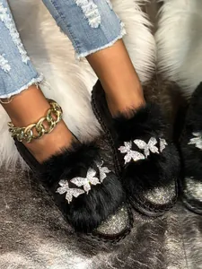 Luxurious black platform loafers featuring rhinestone butterflies and plush faux fur detail