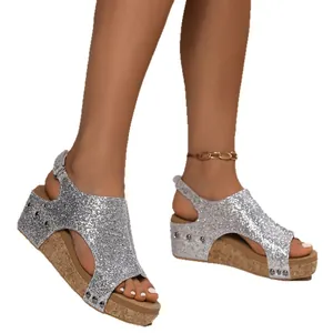 Stylish silver glitter platform wedge sandals for women featuring peep toe and rivet details