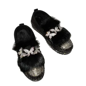 Elegant black platform winter loafers for women featuring warm fur and rhinestone butterfly