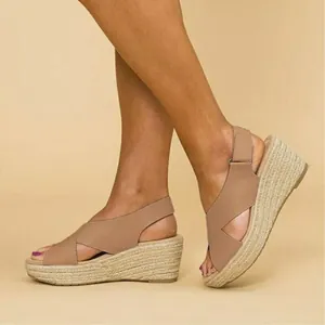 Detailed side view of women's comfortable nude crossover strap espadrille wedge sandals