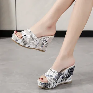 Elegant floral embroidery wedge sandals with open toe design for women's summer style.