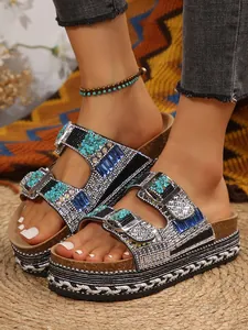 Detail view of bohemian rhinestone double buckle cork platform sandals with hemp trim