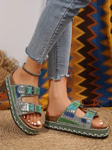 Detailed view of bohemian platform slippers with rhinestones and woven rope sole