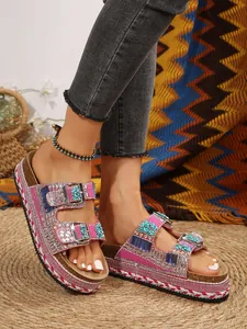 Bohemian rhinestone double buckle platform sandals with cork sole and turquoise details.