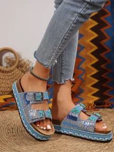 Detailed view of bohemian blue beaded double-buckle slide sandals with cork platform sole