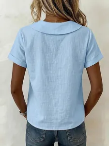 Back view of a light blue short-sleeved cotton linen shirt with Peter Pan collar