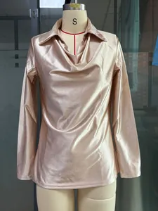Detail view of champagne satin cowl neck blouse featuring a shirt collar on a mannequin stand