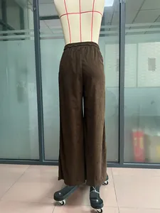 Detailed back view of high-waisted casual brown corduroy wide-leg pants on mannequin.