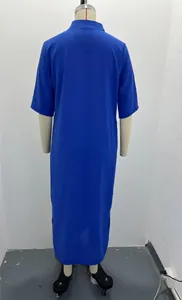 Back view of elegant royal blue short sleeve maxi dress with side slits on mannequin