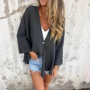 Stylish loose charcoal V-neck cardigan for women in a casual summer street style fashion