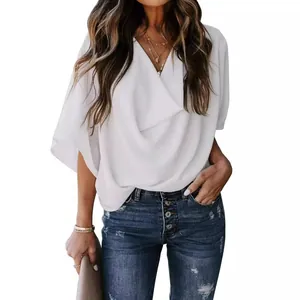 Elegant white chiffon V-neck blouse with loose fit and batwing sleeves for women.