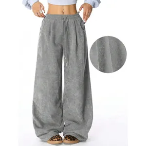 Detailed macro view of grey corduroy fabric on high waist drawstring wide leg pants