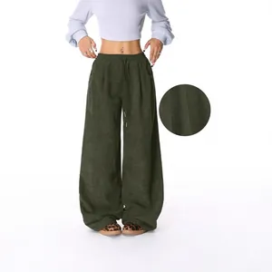 High-waisted green corduroy wide-leg pants with adjustable drawstring and detail view