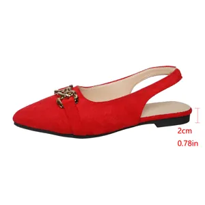 Detail view of red suede slingback flat shoes with gold horsebit and 2cm heel height