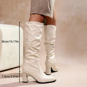 Close-up detail of cream slouchy knee-high boots with 7.4cm block heel dimensions