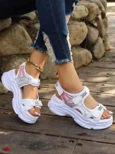 Detailed side view of women's chunky platform sporty sandals with pink accents and velcro straps
