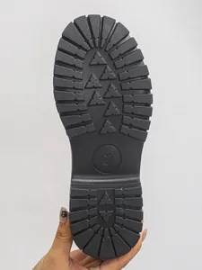 Close-up detail showing the anti-slip black chunky tread on the bottom of a shoe sole