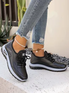 Detailed side view of black women's lace-up platform shoes for leisure