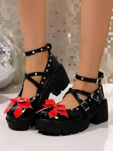 Stylish black platform Mary Jane shoes with red bow details and silver studs for women