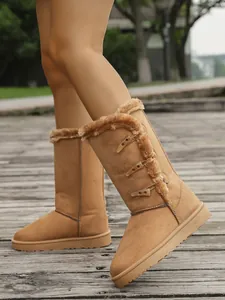 Stylish women's winter snow boots featuring horn buttons and warm faux fur lining