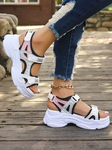 Detail view of women's chunky platform sports sandals in a stylish outdoor setting