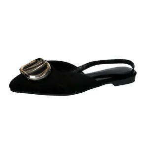 Elegant black pointed toe flat sandals with a gold metal buckle and slingback strap.