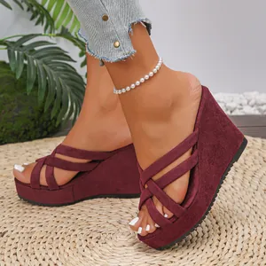 Elegant women's burgundy suede wedge sandals with thick platform and criss-cross straps