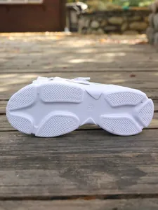 Detailed view of the anti-slip texture on white platform sport sandals for women