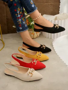 Macro detail of suede slingback flats with gold horsebit buckle in four colors