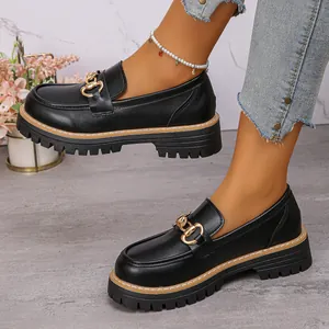 Stylish women's black platform loafers featuring a gold chain buckle and British retro style.