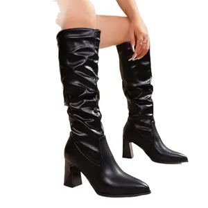 Pointed toe chunky heel knee-high slouch boots in black matte finish, 2025 winter style
