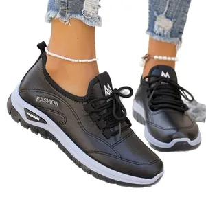 Stylish women's black casual sports shoes featuring a white thick platform sole and front laces