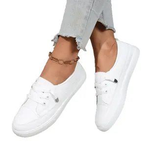 Comfortable casual women's white low-top lace-up sneakers with a durable textured rubber sole