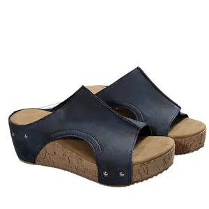Vintage dark blue wedge sandals with thick cork-textured platform sole and rivets