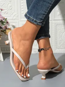 Detailed view of white square toe thong sandals with elegant kitten heels for women